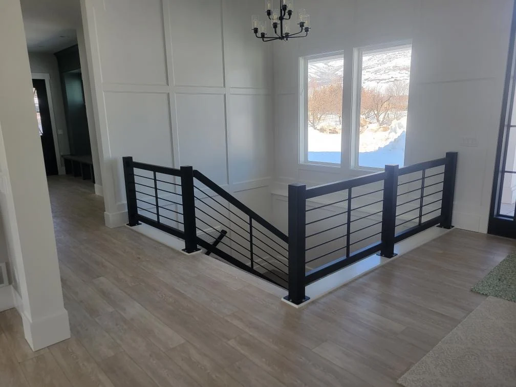 Modern black metal railing for residential property.